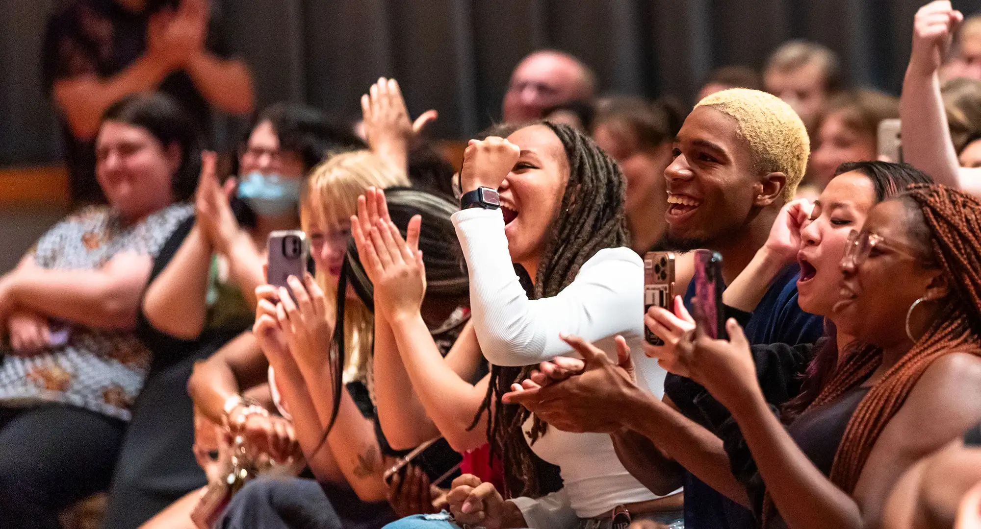 group cheering at an event