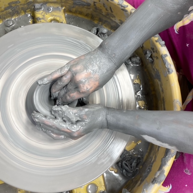 Wheel throwing on pottery wheel